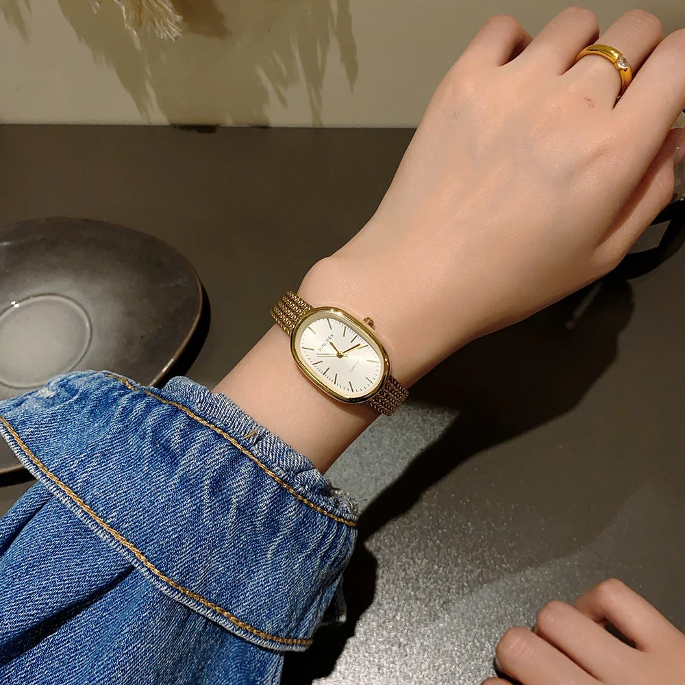 女性用ゴールド腕時計 ヴィンテージブレスレット腕時計 高級小型レディースオーバルクォーツ腕時計